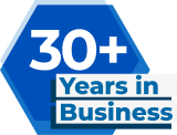Blue hexagon with text "30+ Years in Business," proudly representing Contractor's Asphalt, your trusted partner in asphalt paving.