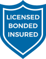Blue shield-shaped logo with text "Licensed Bonded Insured" in white letters, proudly representing Contractor's Asphalt, the trusted name in asphalt paving.