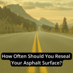 A paved road with mountains in the background and the text, "How Often Reseal Asphalt Surface?" written across the image.